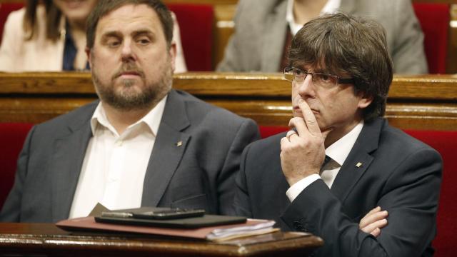 Oriol Junqueras y Carles Puigdemont en el Parlament.