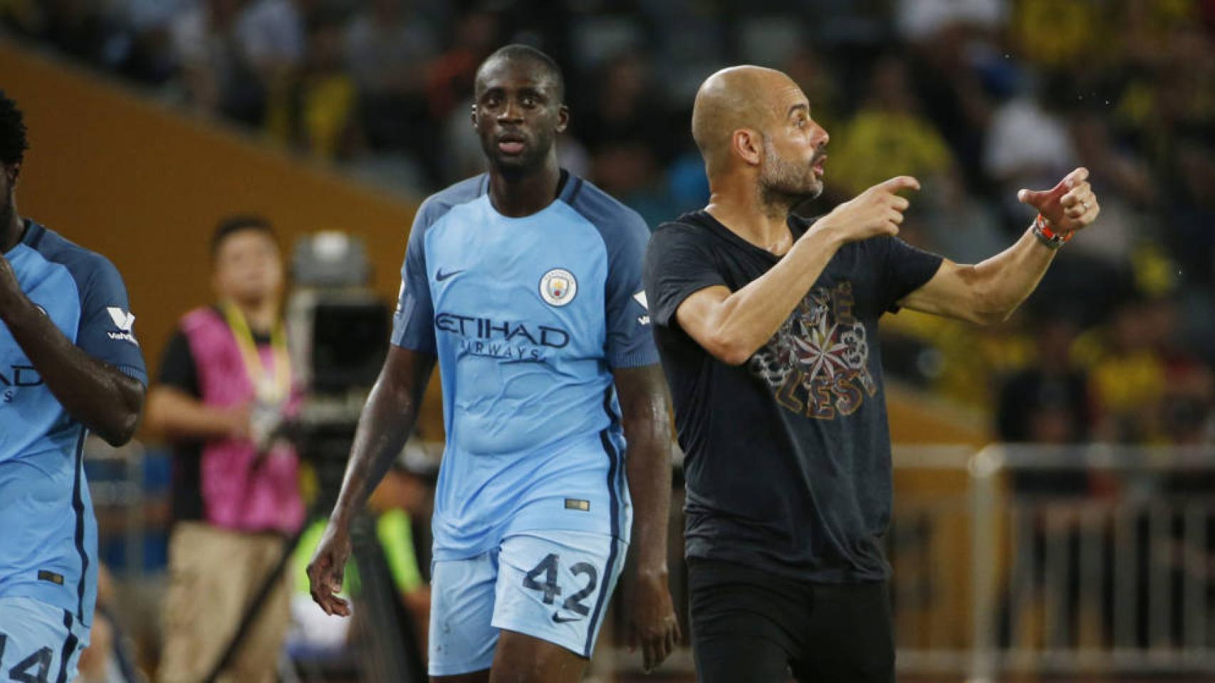 Guardiola y Yaya Touré en un partido con el Manchester City.