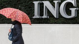 A pedestrian walks past the logo of ING bank by the group's main office in Brussels
