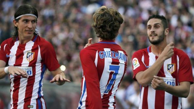 Koke, Filipe y Griezmann celebran el tercer gol.