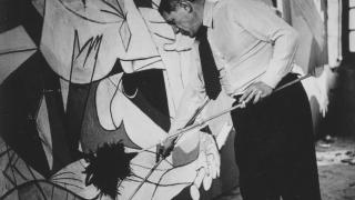 Pablo Picasso during the creation of Guernica, portrayed by Dora Maar.