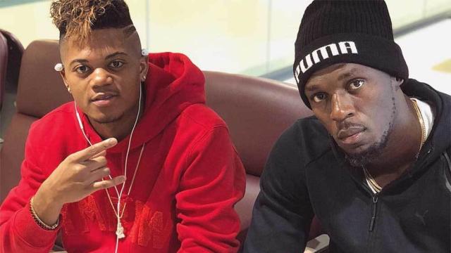 Leon Bailey junto a Usain Bolt.