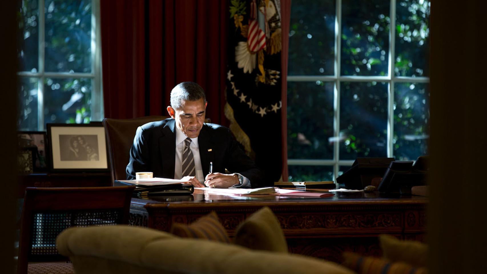 Light matters. The paper that the President was writing on provided some fill light as he worked at the Resolute Desk in the Oval Office on October 18, 2013. # Pete Souza / The White House