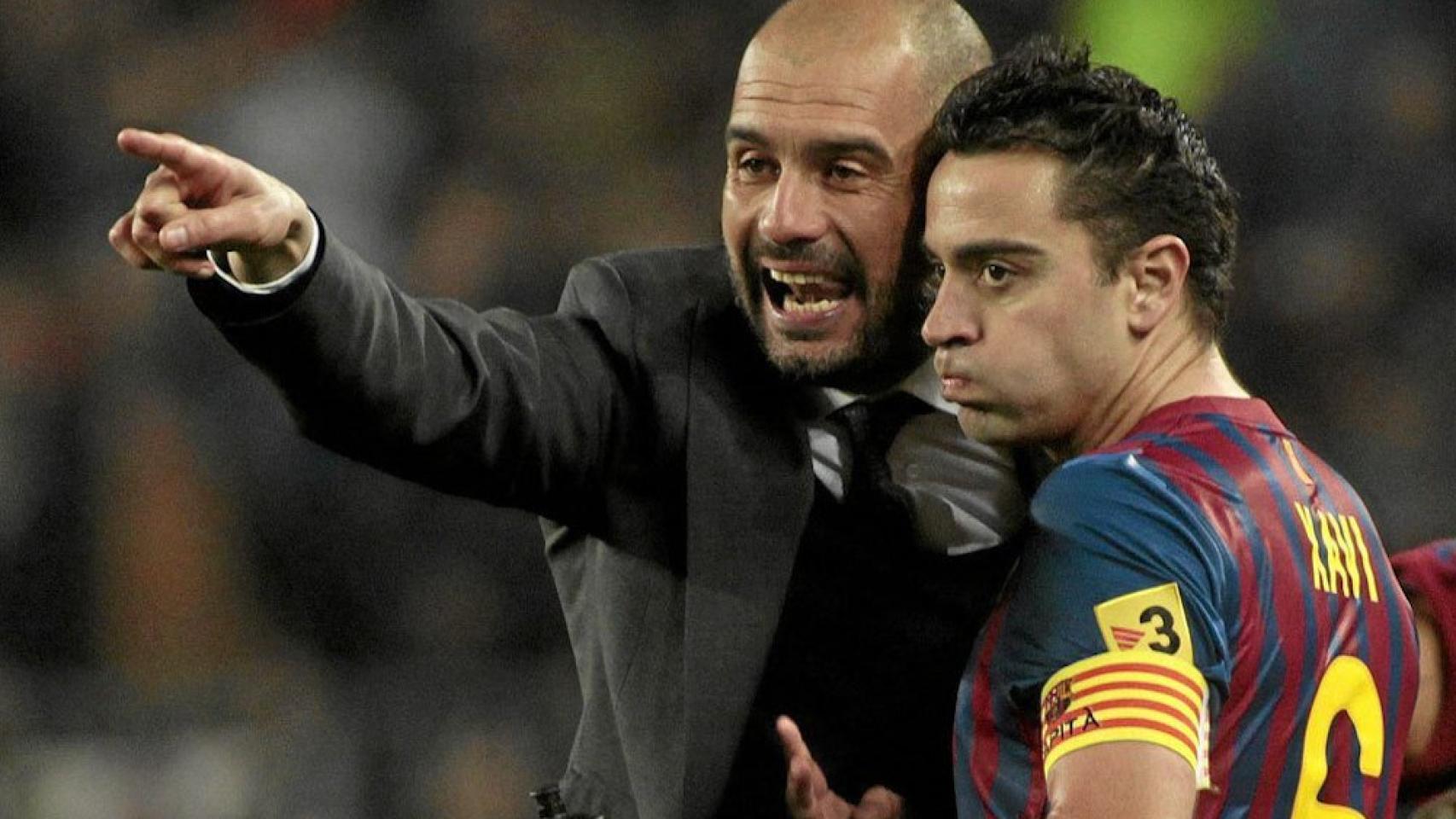 Pep Guardiola y Xavi, en el Barcelona