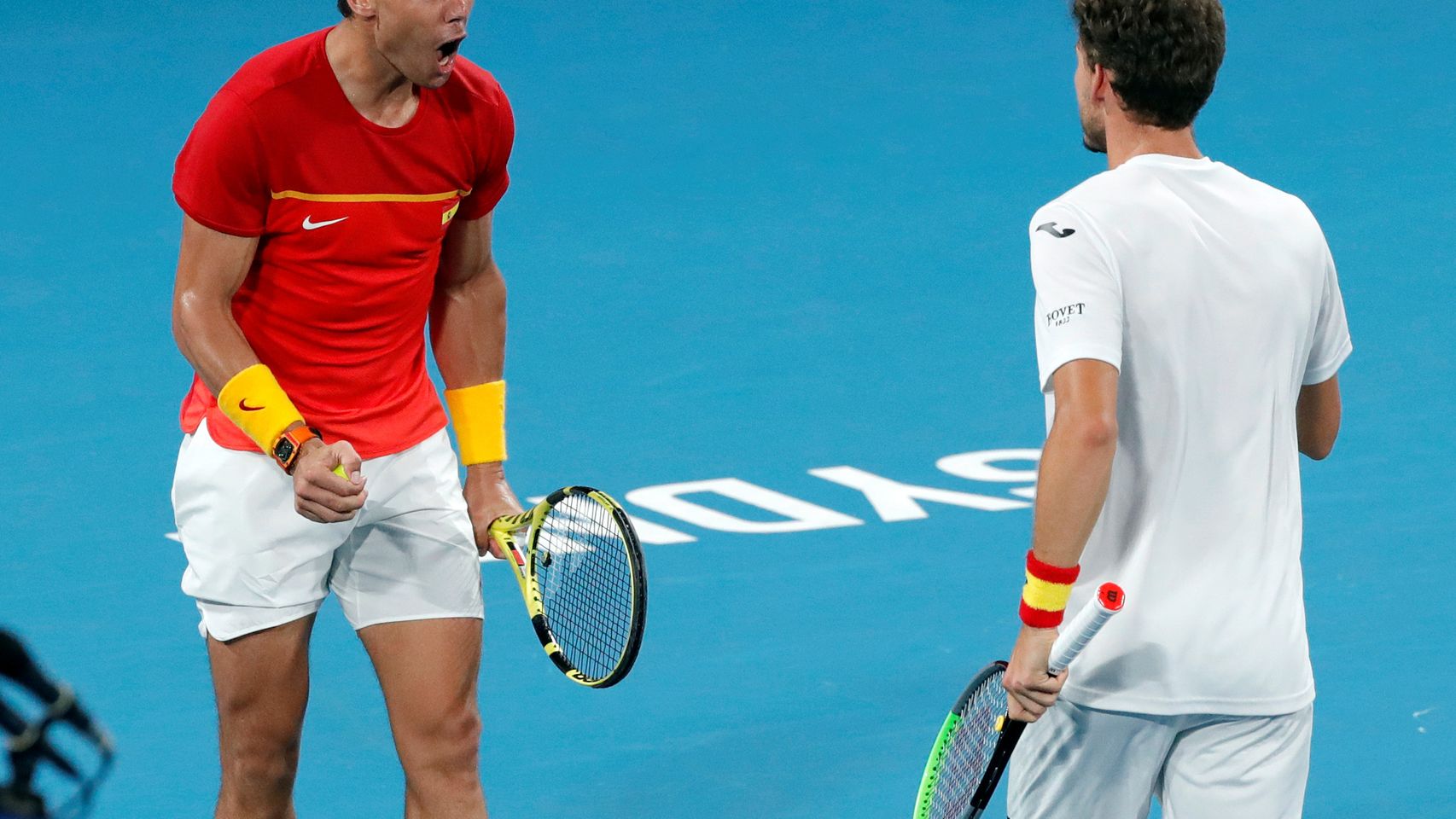Nadal y Carreño, durante el partido de dobles.