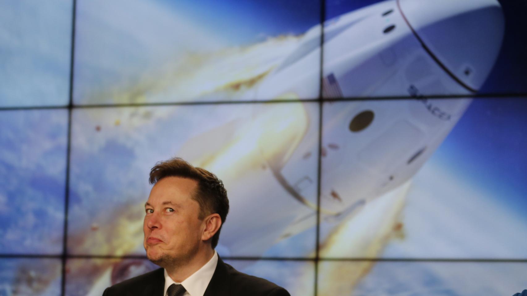 SpaceX founder and chief engineer Elon Musk reacts during a post-launch news conference to discuss the SpaceX Crew Dragon astronaut capsule in-flight abort test at the Kennedy Space Center