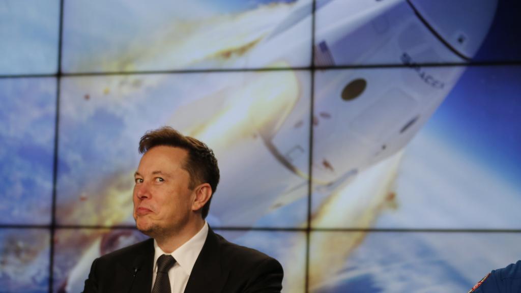 SpaceX founder and chief engineer Elon Musk reacts during a post-launch news conference to discuss the  SpaceX Crew Dragon astronaut capsule in-flight abort test at the Kennedy Space Center