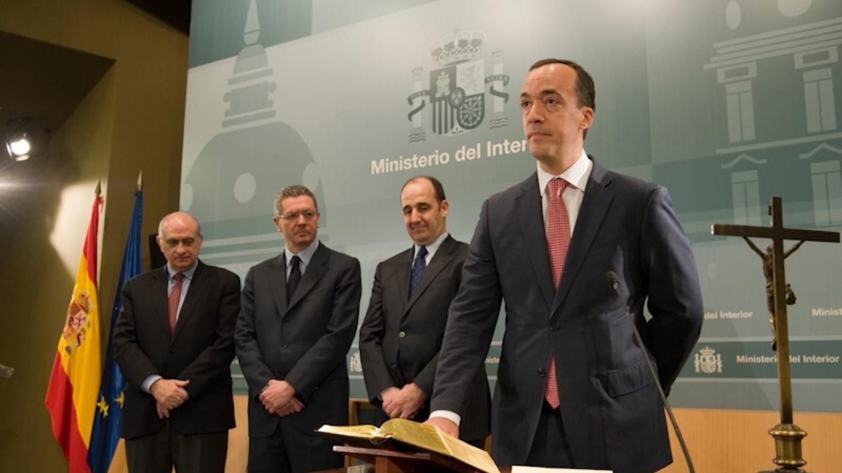 Francisco Martínez, ex secretario de Estado de Seguridad, el día de la jura de su cargo, ante los ministros Jorge Fernández Díaz y Alberto Ruiz-Gallardón.