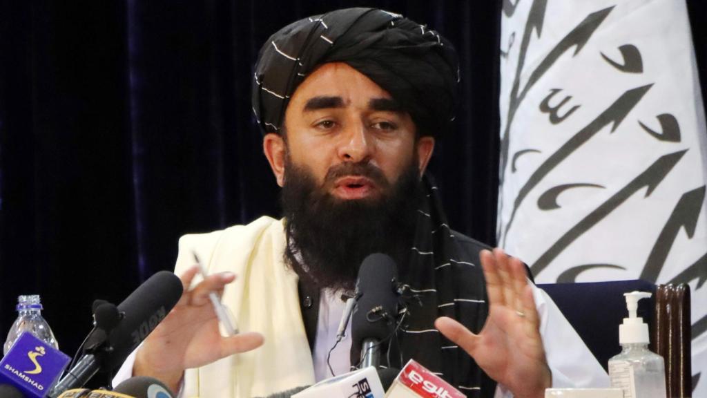 Taliban spokesman Zabihullah Mujahid at a press conference.