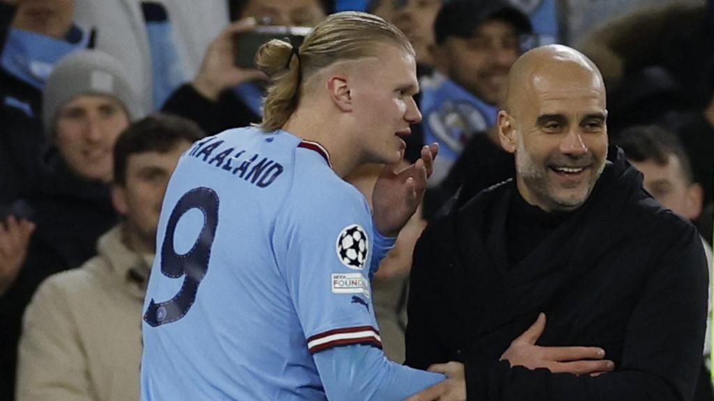 Erling Haaland y Pep Guardiola, en un partido de Champions League