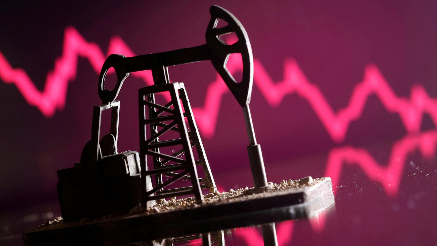 Representación de una bomba de petróleo sobre un gráfico con tendencia a la baja.
