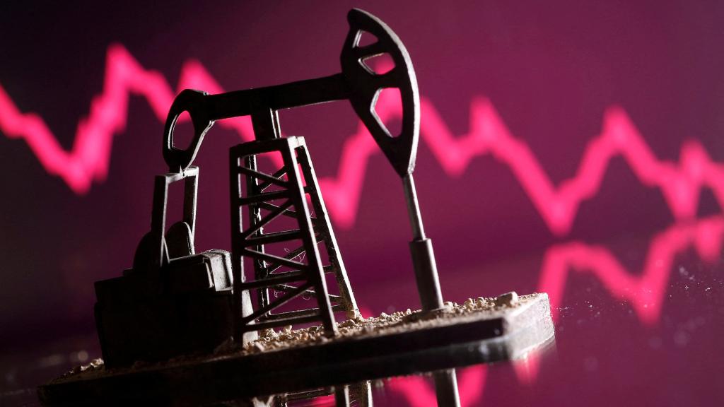 Representación de una bomba de petróleo sobre un gráfico con tendencia a la baja.