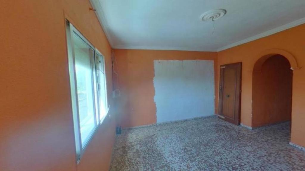 Salón de la casa tras el paso de los 'okupas'