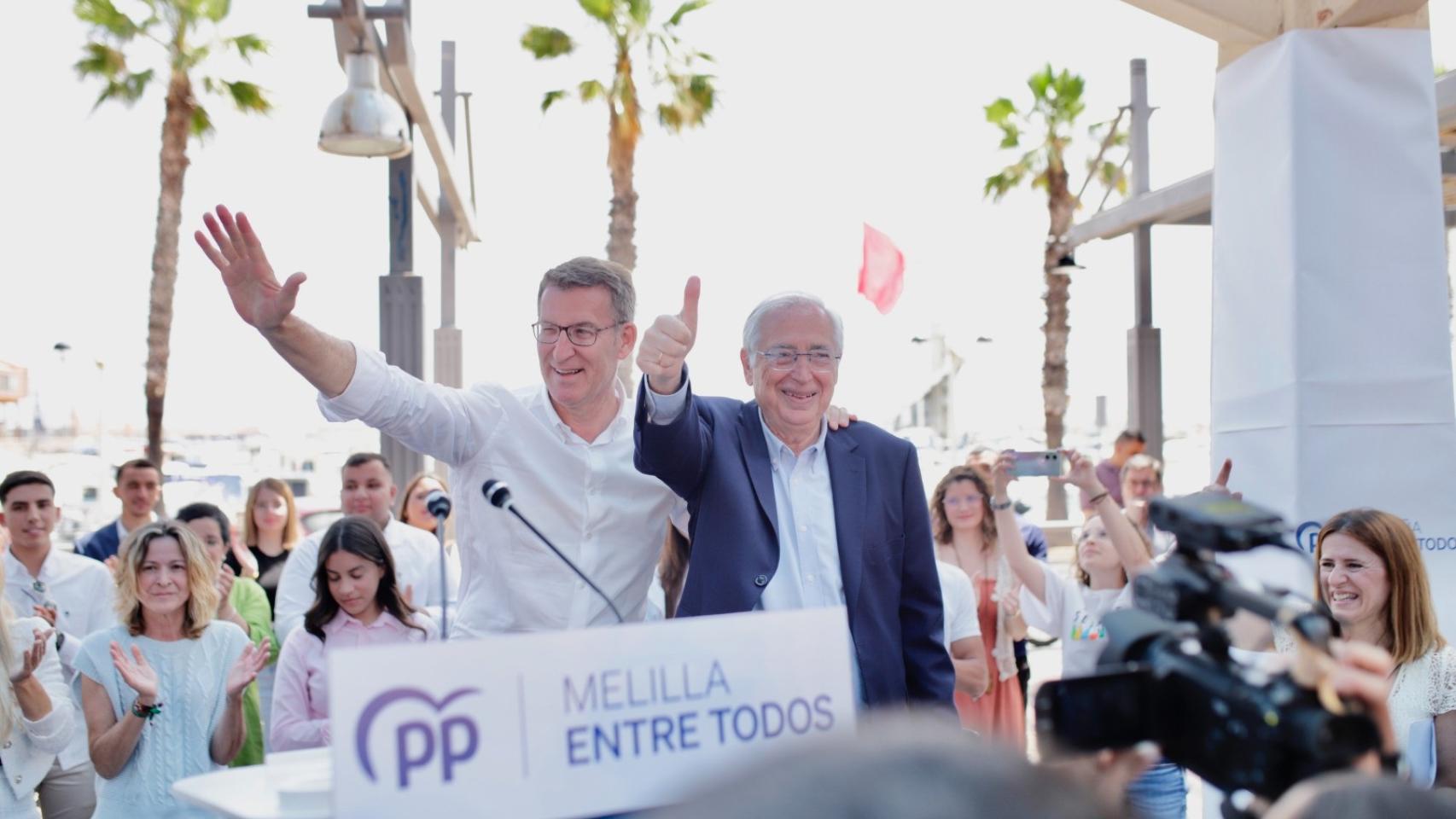 El presidente del Partido Popular, Alberto Núñez Feijóo, y el líder del PP en Melilla, Juan José Imbroda.