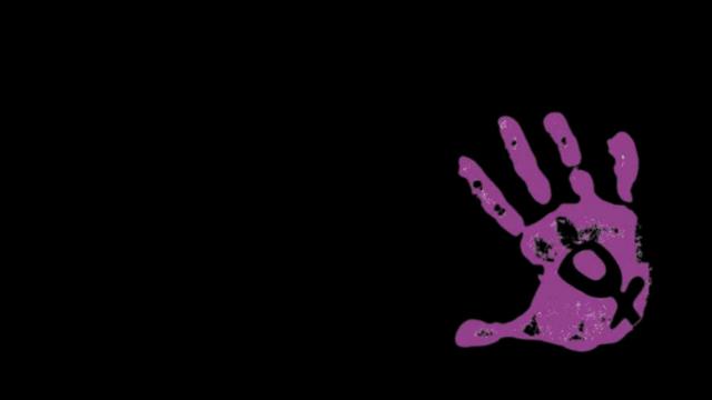 Una mano morada sobre un fondo negro.