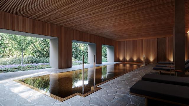 Zona de piscina en el spa interior del edificio.