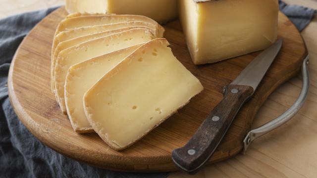 high-angle-delicious-cheese-wooden-board
