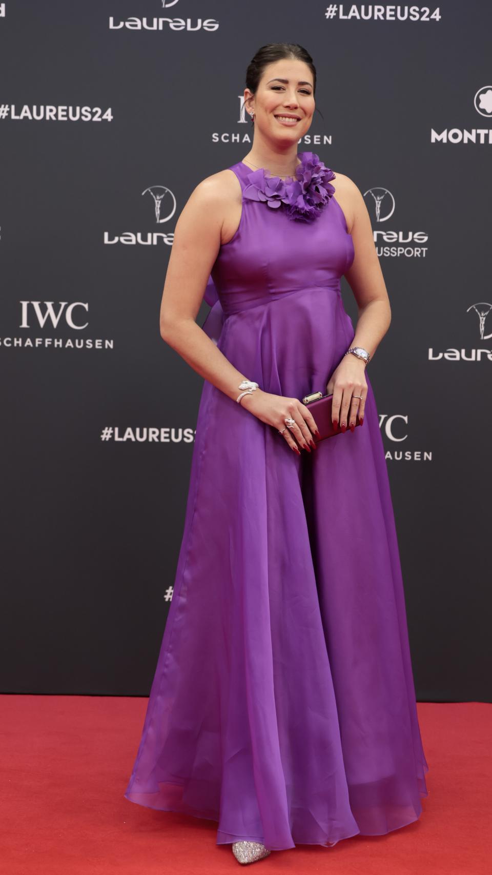 La tenista luciendo un vestido morado con escote halter, este pasado lunes.