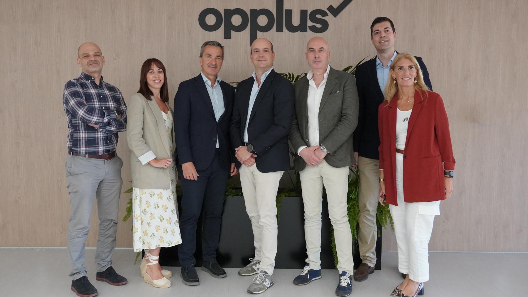 Directivos de Opplus y GFT.