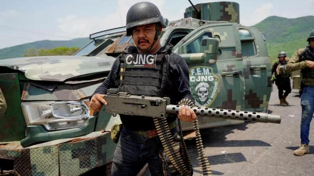 A member of the CJNG shows a heavy weapon in the state of Michoacán.