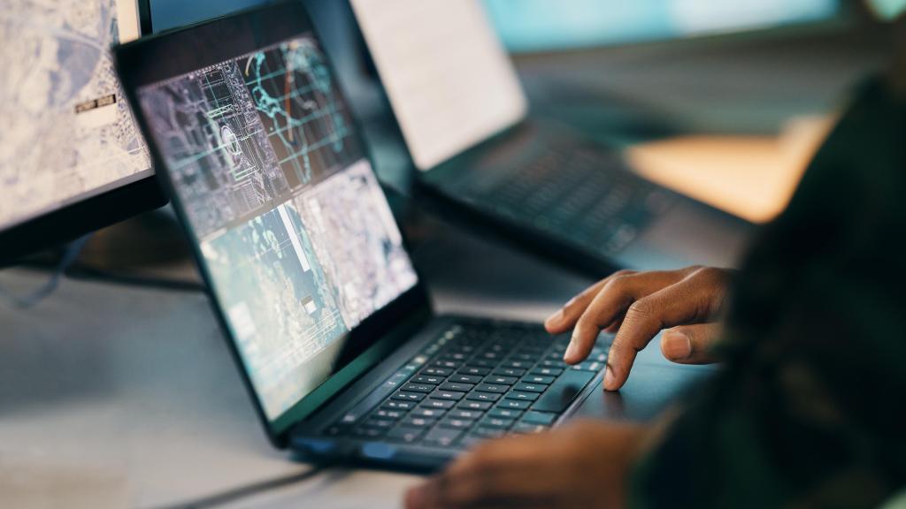 hands-typing-laptop-and-closeup-on-table-of-milit-2023-11-27-05-00-23-utc