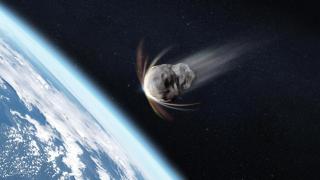 El planeta Tierra y un gran asteroide