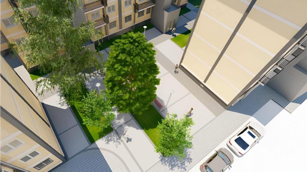 La futura plaza, con árboles y equipamiento, desde arriba.