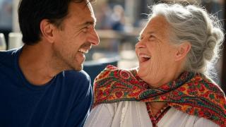 Imagen de archivo. Hombre y mujer riendo.