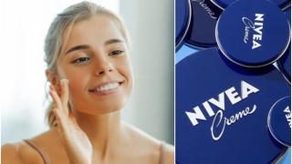 Mujer frente al espejo aplicándose crema en el rostro.