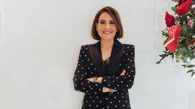 Boticaria García posando en un evento.