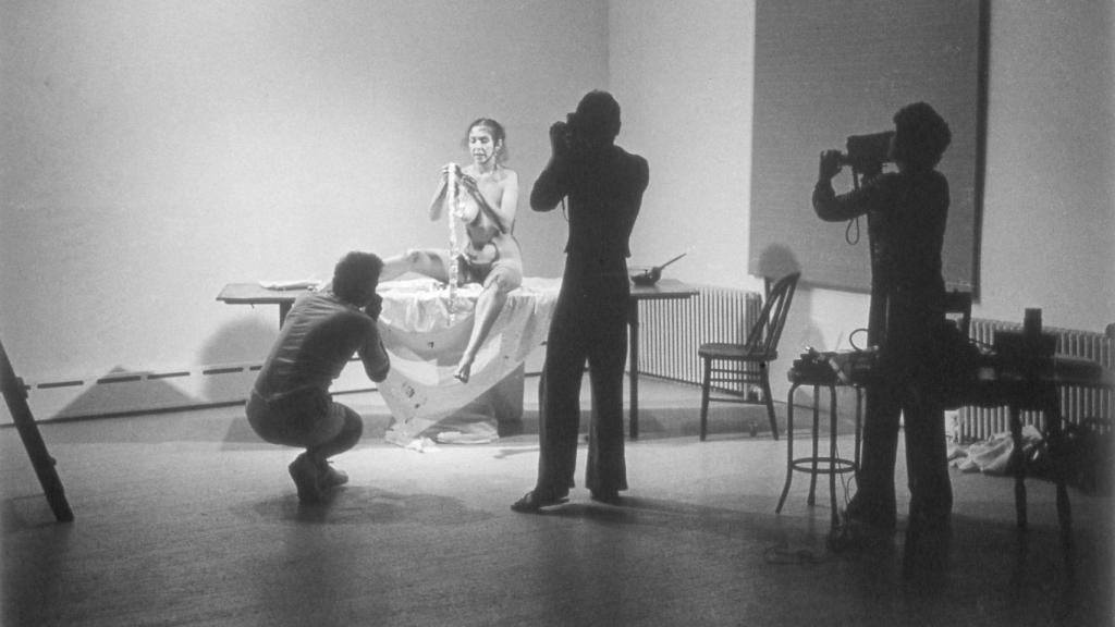 Anthony McCall, photograph of Carolee Schneemann, Interior Scroll, 1975. Stockholm: Moderna Museet. © Carolee Schneemann. Photo: Estate of Carolee Schneemann/Galerie Lelong & Co./Hales Gallery/PPOW Gallery.