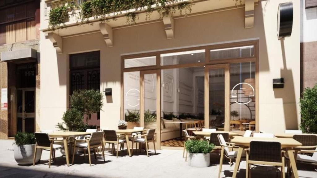 Diseño previsto para el bajo del edificio cuando se proyectaba un local hostelero.