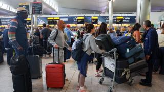 A queue of passengers at Heathrow airport.