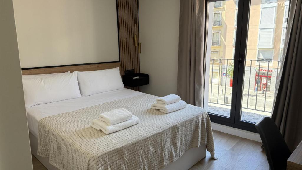 Una de las habitaciones del Hostal Le Petit.