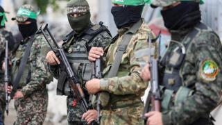 Armed men stand guard at the funeral of Marwan Issa, a senior Hamas deputy military commander.