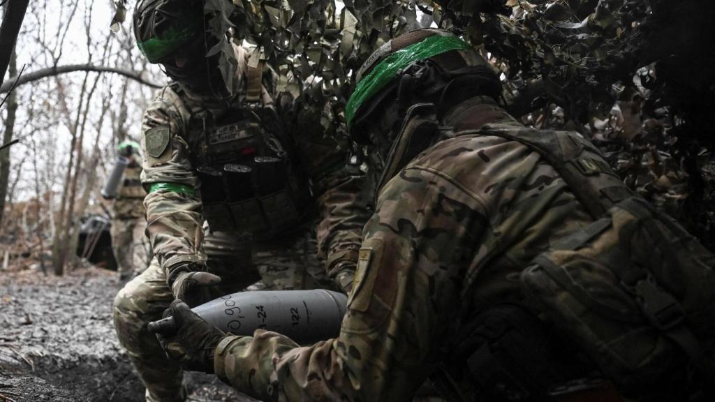 Ukrainian soldiers prepare to fire on Russian troops at a front line position near the city of Pokrovsk.