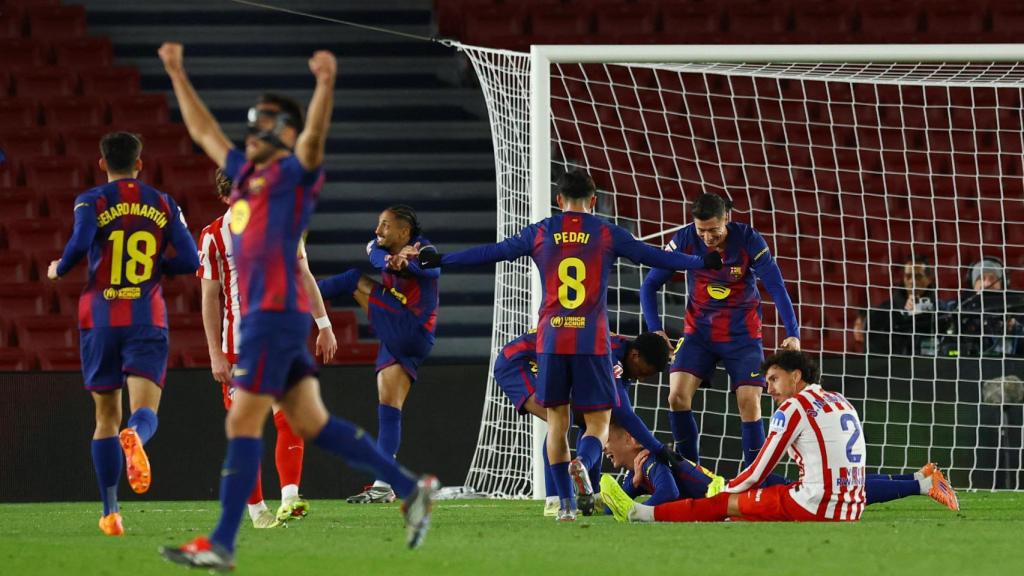 Barcelona players celebrate Dani Olmo's goal.