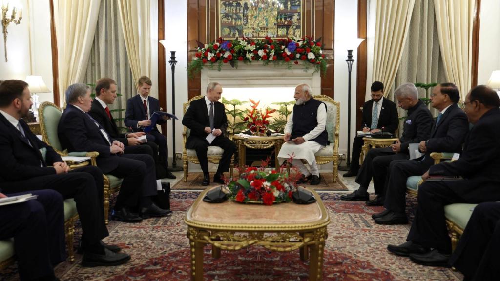 The teams of Vladimir Putin and Narendra Modi during their meeting in New Delhi.