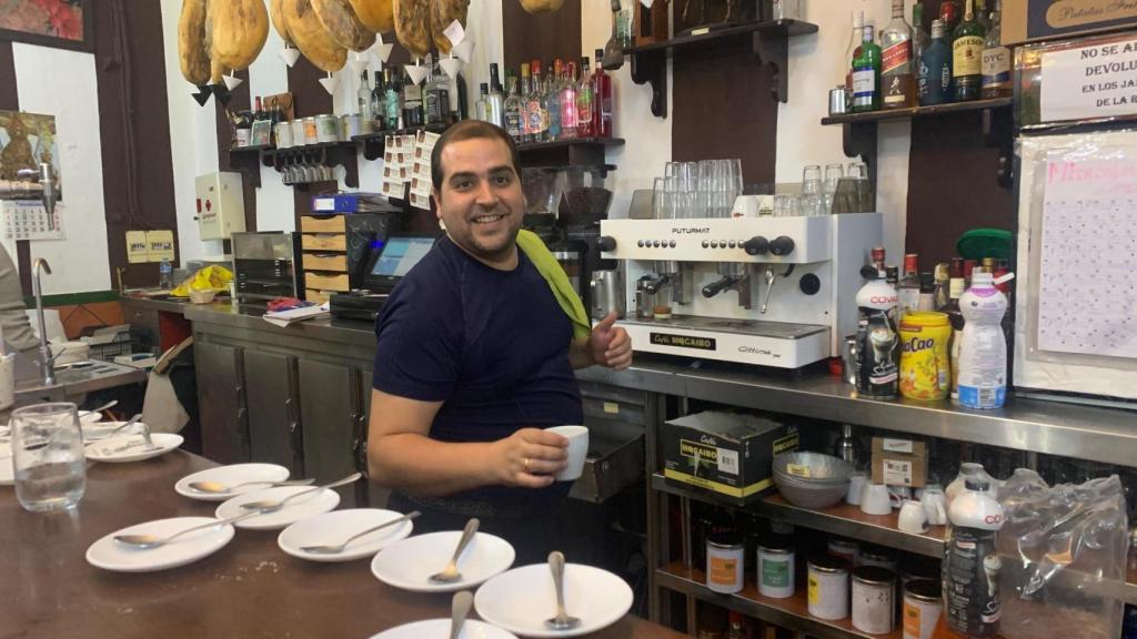 Alvaro serves coffee in his establishment located in central Montellano.