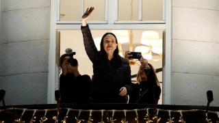 Nobel Peace Prize laureate María Corina Machado gestures from the balcony of the Grand Hotel in Oslo, Norway, December 11, 2025.