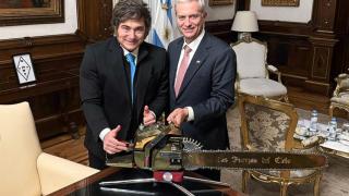 The president of Argentina, Javier Milei, poses with the elected president of Chile, José Antonio Kast, and a chainsaw in Casa Rosada..