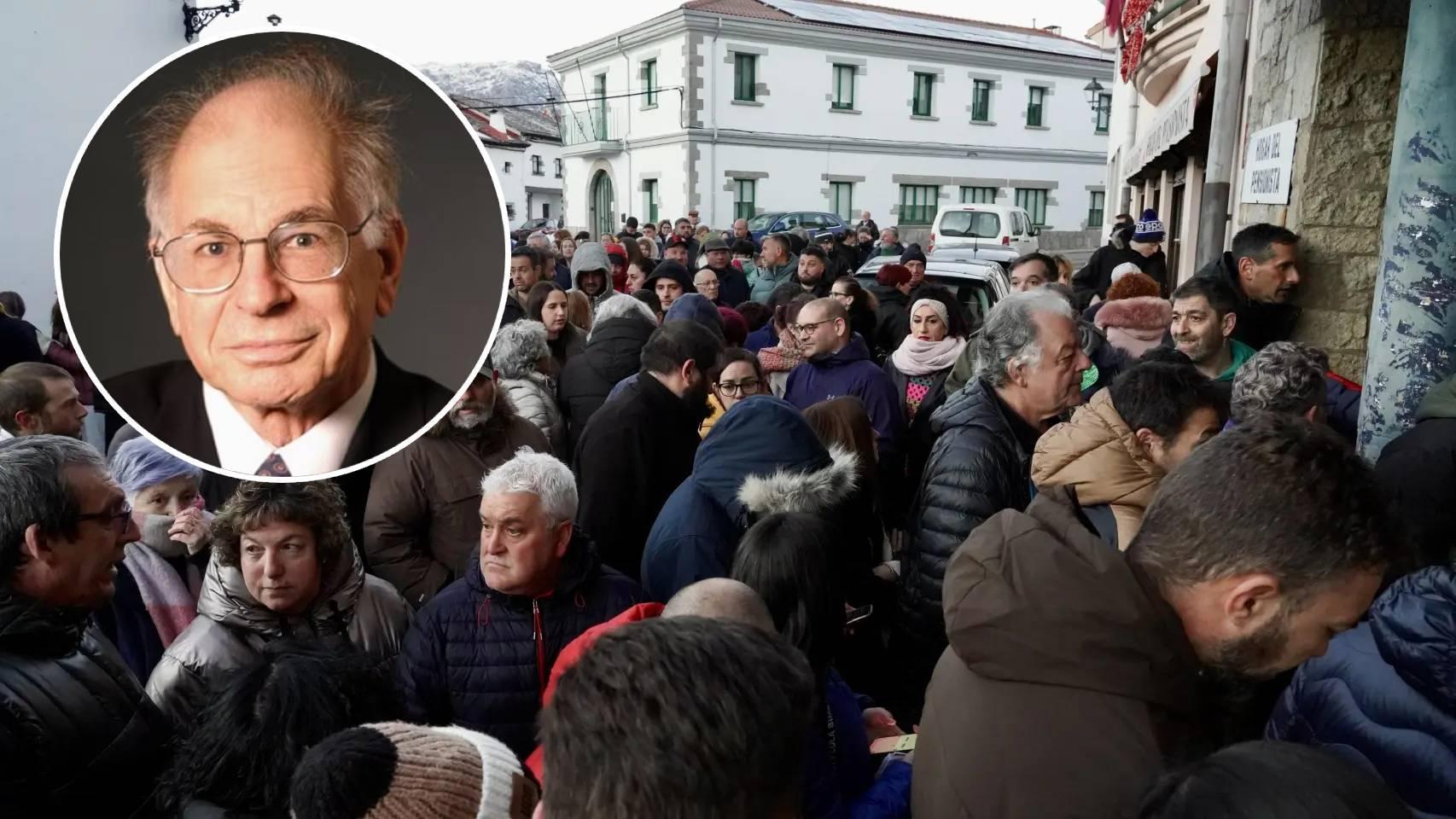 El psicólogo Daniel Kahneman junto a la reunión entre la comisión de fiestas de Villamanín y los vecinos premiados con el Gordo.