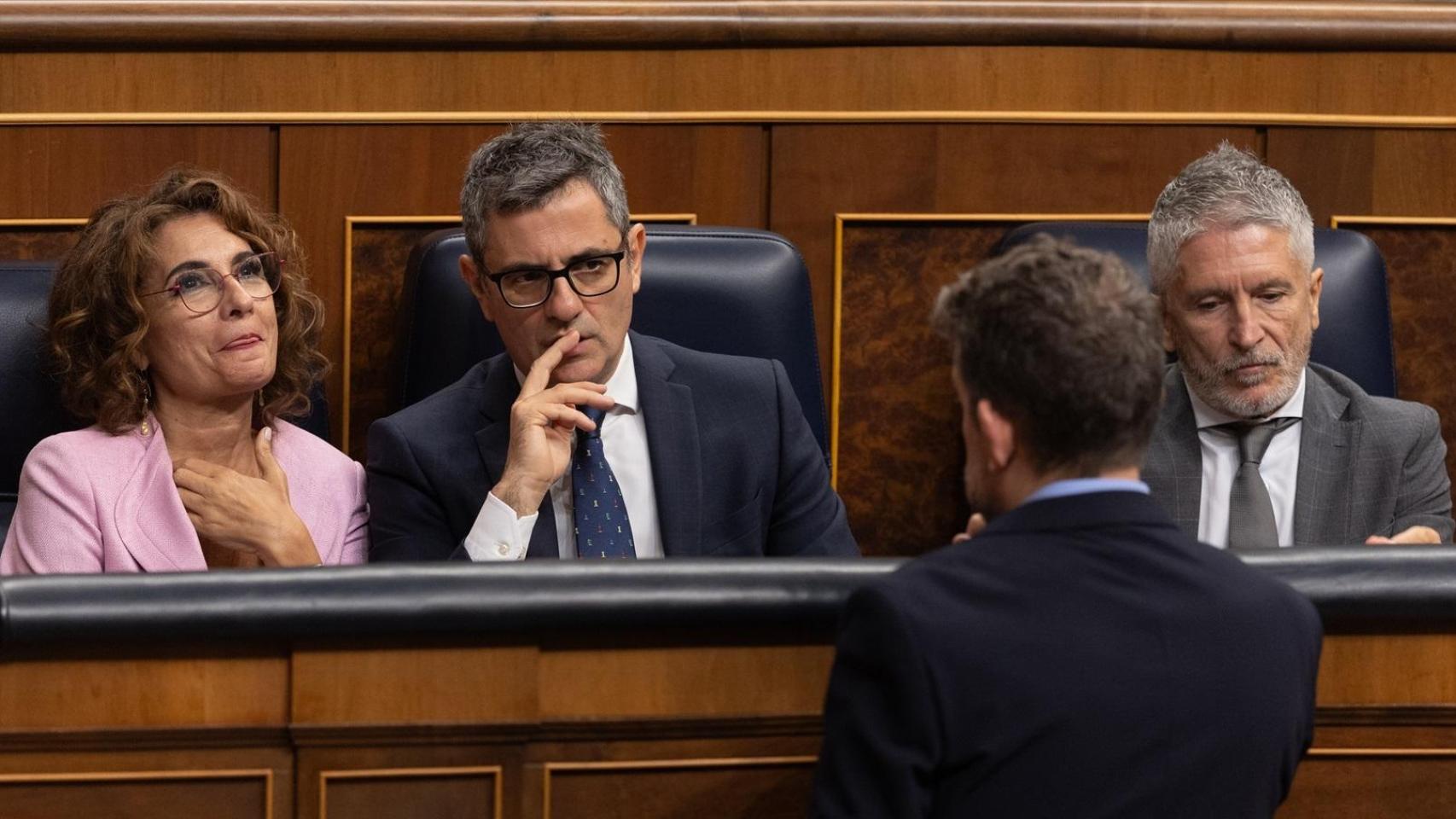 María Jesús Montero, Félix Bolaños y Fernando Grande-Marlaska, en el Congreso, durante una sesión de control al Gobierno.