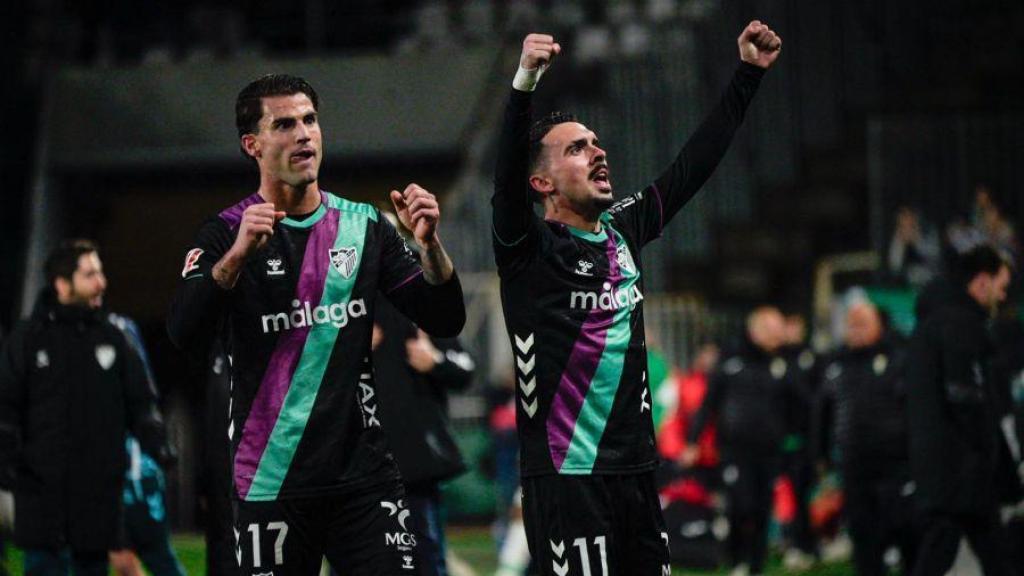 Jauregi y Joaquín Muñoz celebran el triunfo del Málaga en Córdoba.