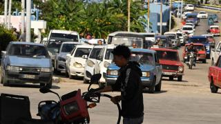 A driver fills his tank at a gas station in Havana during the blockade of oil supplies to Cuba.