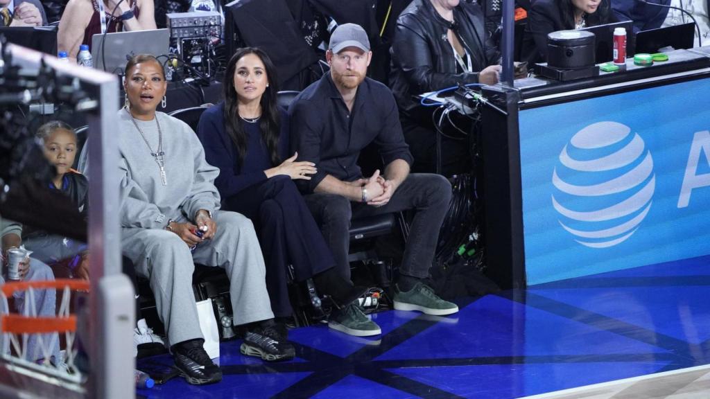 Meghan y Harry sentados en primera fila junto a Queen Latifah.