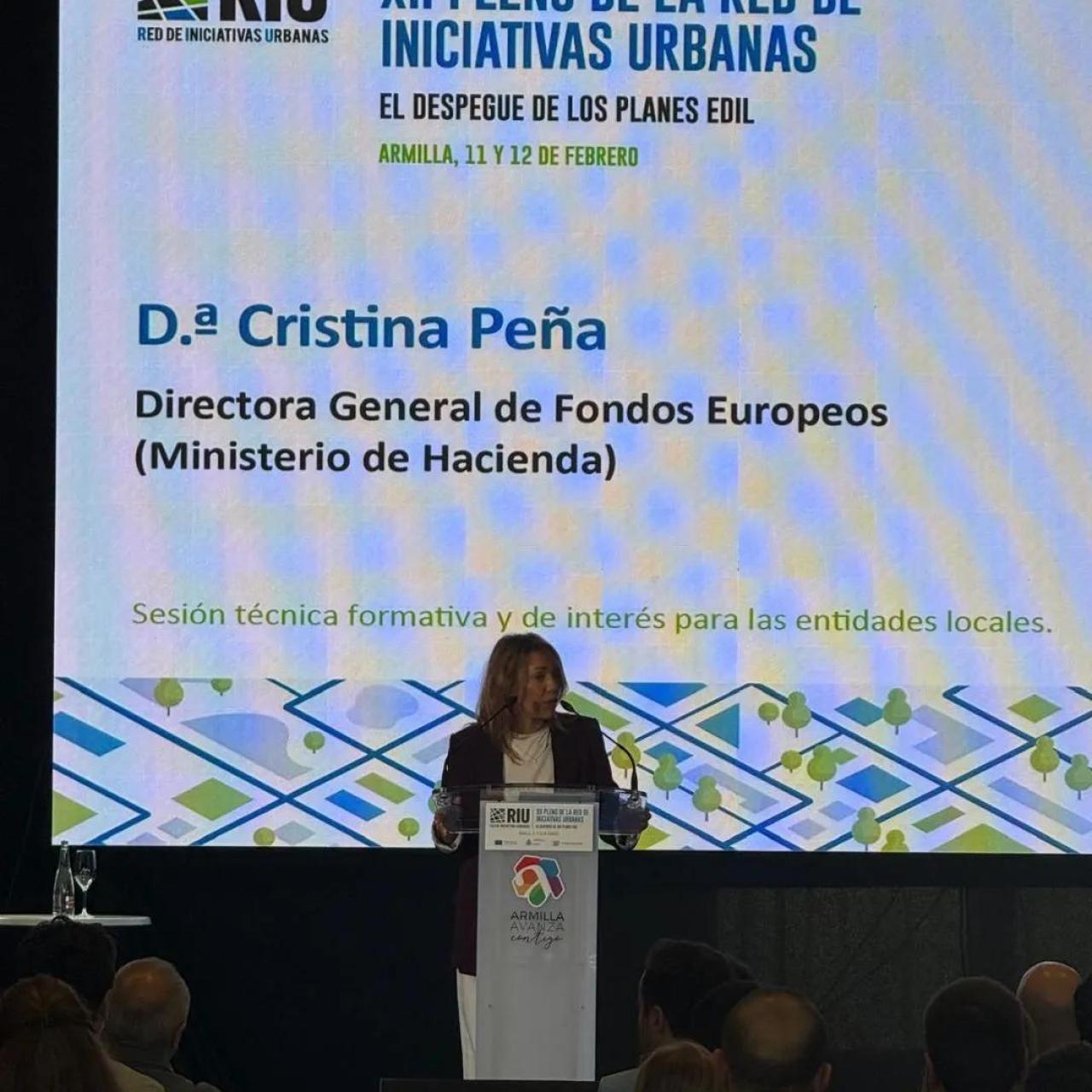 Cristina Peña, directora general de Fondos Europeos del Ministerio de Hacienda, interviniendo en el XII Pleno de la Red de Iniciativas Urbanas (RIU)
