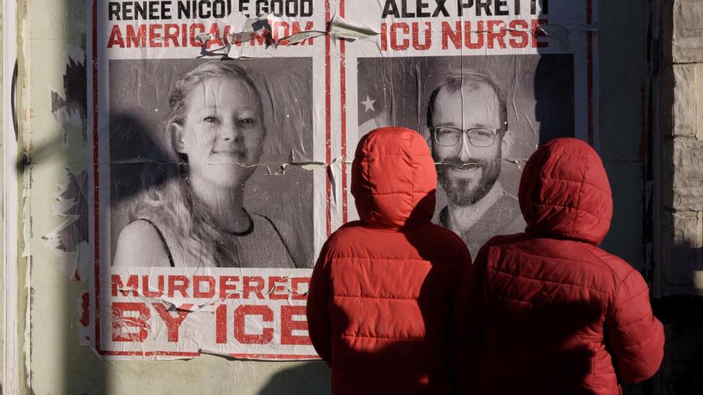 Posters on the streets of Minneapolis with the faces of Renee Nicole Good and Alex Pretti, fatally shot by immigration agents.