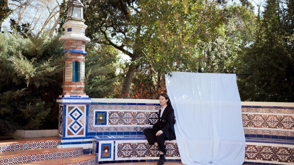 Sara Torres sat at the azulejo table.