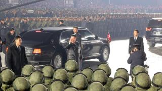Kim Jong-un greets his soldiers during the military parade in Pyongyang.